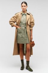 Profile view of model wearing the Oroton Mica Mini Bowler in Brandy and Pebble leather for Women