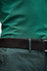 Profile view of model wearing the Oroton Lottie Rib Tank in Villa Green and 92% Cotton / 8% Spandex for Women
