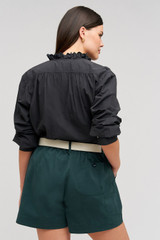 Profile view of model wearing the  Alfie Carpenter Short in  and Crafted from cotton twill  for Men