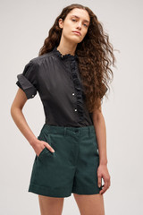 Profile view of model wearing the  Alfie Carpenter Short in  and Crafted from cotton twill  for Men