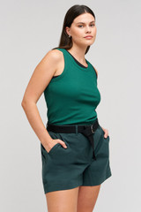 Profile view of model wearing the Oroton Lottie Rib Tank in Villa Green and 92% Cotton / 8% Spandex for Women