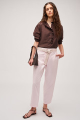 Profile view of model wearing the  Hazel Ruffle Blouse in Chocolate and Made from 100% poplin cotton  for Men