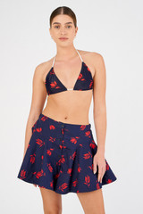 Profile view of model wearing the Oroton Dutch Tulip Skort in North Sea and 100% cotton for Women