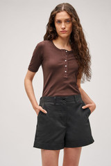 Profile view of model wearing the  Margot Rib Henley in Chocolate and 92% Cotton / 8% Spandex for Men