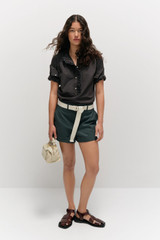 Profile view of model wearing the  Alfie Carpenter Short in  and Crafted from cotton twill  for Men