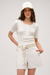 Profile view of model wearing the  Margot Rib Henley in Antique White and 92% Cotton / 8% Spandex for Men