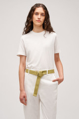 Profile view of model wearing the  Maggie Classic Tee in  and Made from 100% cotton for Men