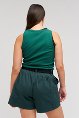 Profile view of model wearing the Oroton Lottie Rib Tank in Villa Green and 92% Cotton / 8% Spandex for Women
