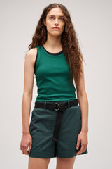 Profile view of model wearing the Oroton Lottie Rib Tank in Villa Green and 92% Cotton / 8% Spandex for Women