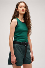 Profile view of model wearing the Oroton Lottie Rib Tank in Villa Green and 92% Cotton / 8% Spandex for Women