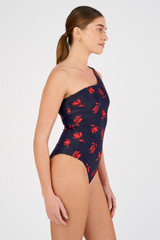 Profile view of model wearing the Oroton Dutch Tulip Asymmetric One Piece in North Sea and 78% polyamide, 22% elastane for Women