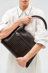 Profile view of model wearing the Oroton Audrey Texture Three Pocket Day Bag in Mahogany and Textured leather for Women