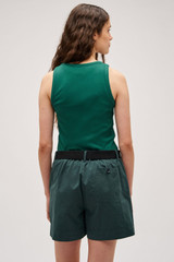 Profile view of model wearing the Oroton Lottie Rib Tank in Villa Green and 92% Cotton / 8% Spandex for Women