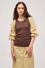 Profile view of model wearing the Oroton Lottie Rib Tank in Chocolate and 92% Cotton / 8% Spandex for Women