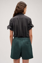 Profile view of model wearing the  Alfie Carpenter Short in  and Crafted from cotton twill  for Men