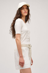 Profile view of model wearing the  Margot Rib Henley in Antique White and 92% Cotton / 8% Spandex for Men